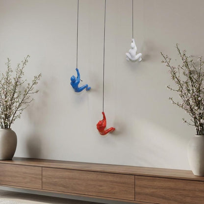 Set of Three Blue Red And White Resin Climbing Man Hanging Dimensional Sculpture