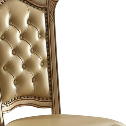 Set of Two Tufted Bone and Brass Upholstered Faux Leather And Wood Dining Side Chairs