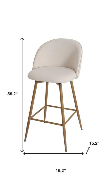 27" Beige And Oak Fabric And Metal Low Back Counter Height Swivel Bar Chair